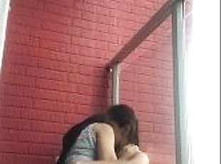 Hot girls film themselves kissing and touching each other on the balcony