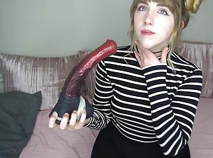 Playful camwhore sucks sex toys in solo action