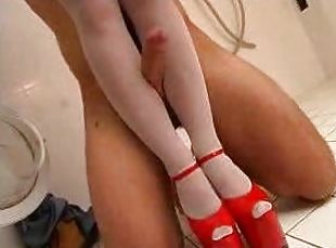 Kinky chick pleases a man with a footjob in the laundry