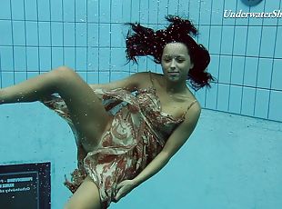 Russian brunette teen shading attire in the pool lovely