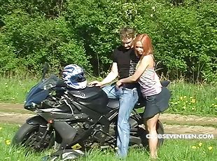Parking his bike and fucking a hot teen redhead in the grass