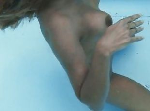 Half Russian and Spanish chick Irina Cage nude swimming
