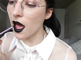 Putting on black lipstick for your pleasure by Domino Faye