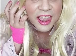 Transvestite princess dressed in pink plays with her cock and ass