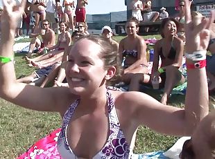 Outdoor reality clip with chicks wearing bikinis having fun at a party