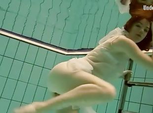 Flawless teen in sheer white lingerie swims