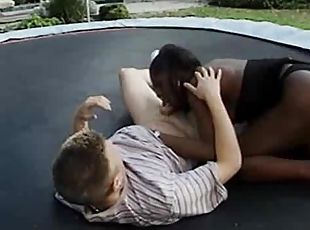 Black tgirl on trampoline gives a BJ