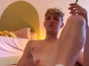 Cute twink in socks smokes a joint while playing with his HARD uncut cock!
