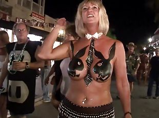 Ladies at Mardi Gras demonstrate their sexy body paint