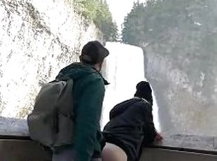 Fucking outdoors in front of a public waterfall