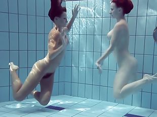 Katrin Swims And Strips Lucy In The Swimming Pool