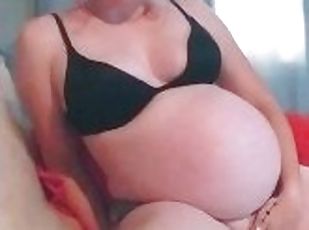 Pregnant showing off body