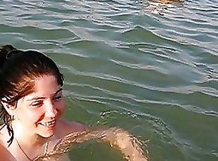 Naturally Busty Brunette Swimming Topless at the Beach