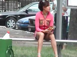 Upskirt on a bus bench with a beauty