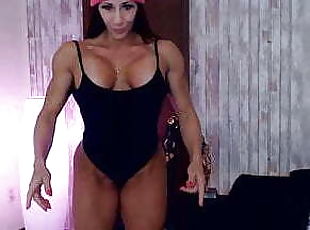 Fitness mistress Larissa posing and flexing big biceps