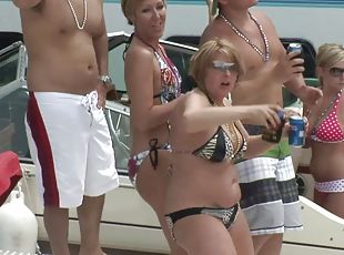 Babes on the yacht showing off pussy and ass in bikini
