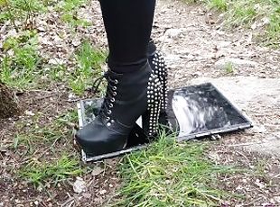Playing with a old laptop screen in high heels