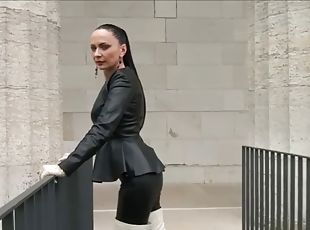 Mistress walking in high white boots