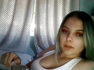 Long-haired blonde fucked herself in front of the webcam