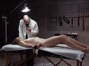 Tied up patient enjoys having her pussy pleasured by a doctor