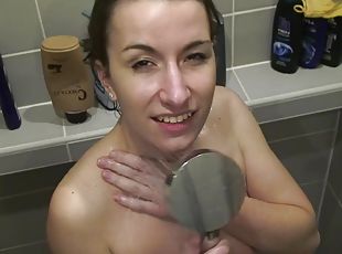 Beautiful girlfriend shows how she shampoos and washes her hairy slit while showering.