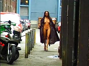 Good-looking ebony babe flashing her tits and pussy in public