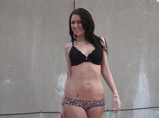 Skinny solo model unpinning her bra and panties to showcase her pierced big tits outdoor
