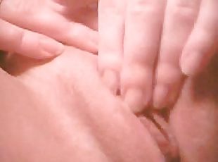 Horny amateur chick fingers her shaved pussy in close up solo clip