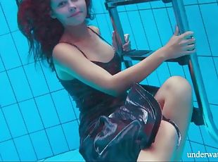 Brunette Nata Szilva strips naked underwater and gets horny