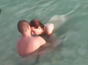 Mature couple sex in the sea