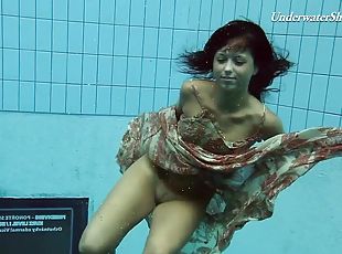 Russian teen diving while showing off her natural tits