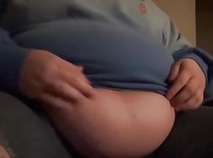 stuffed belly girl rubs her aching belly