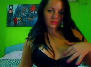 Webcam girl flaunts her huge tits and round ass on cam.
