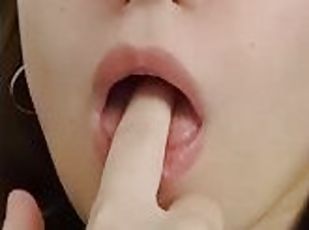 Pretty girl sucking her finger