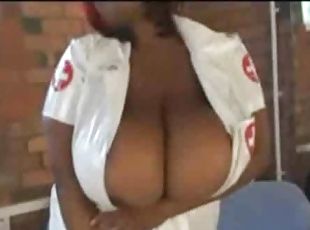 Mega tits on the black BBW nurse