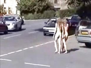 Two naughty blondes running naked in the public park