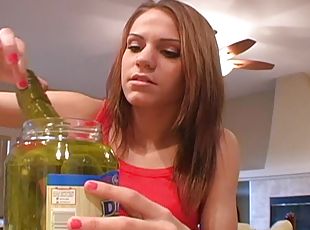 Bad teen tries to look horny playing with a pickled cucumber