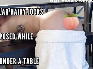 Muscular hairy jock ass exposed while stuck under the table