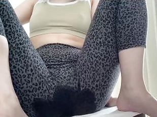 A Japanese girl wetting leggings while watching YouTube