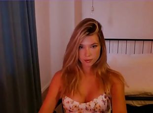 Cute slim blonde with big tits teases on webcam