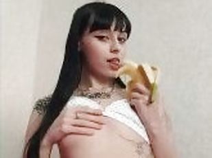 hot tattooed girl training to give a blowjob on a banana