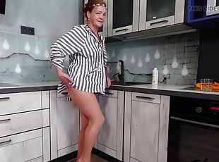 Sexy granny Iris in the kitchen teases in nude pantyhose